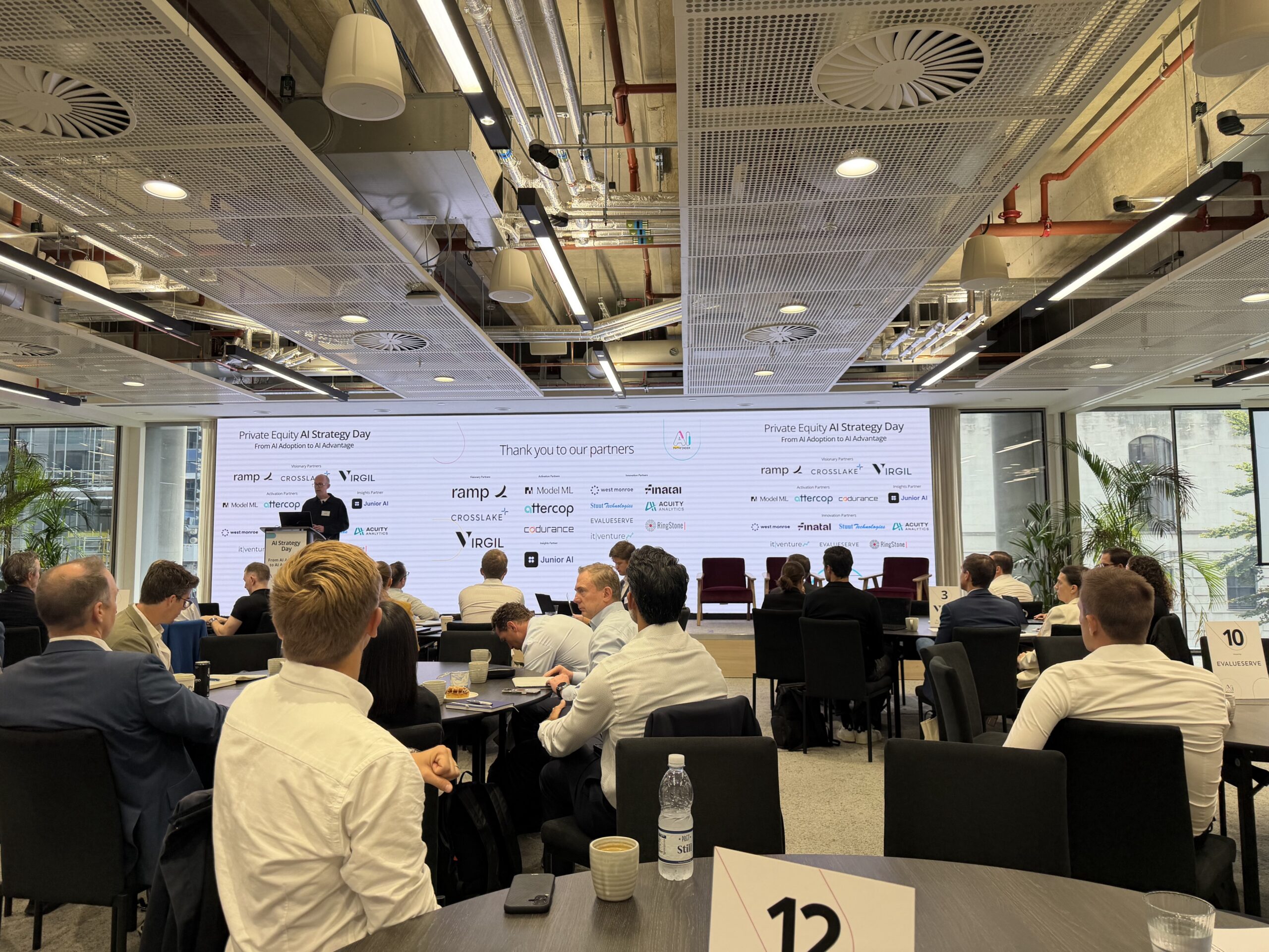 Audience and stage at AI Pathfinder’s Private Equity AI Strategy Day in London, with Finatal shown among the event partners.