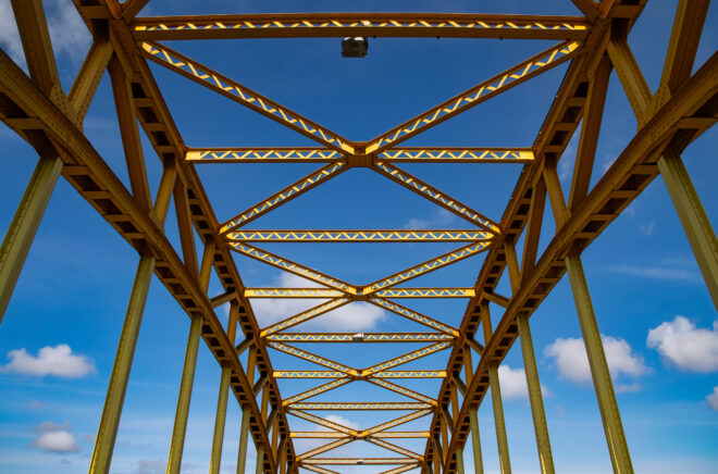 Old iron arch bridge. Construction metal frame
