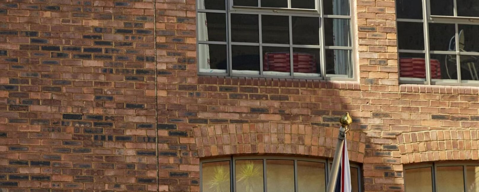 Brick building exterior on the CFO Launchpad roundtable cover